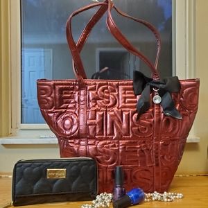 Red tote with bow and black wallet